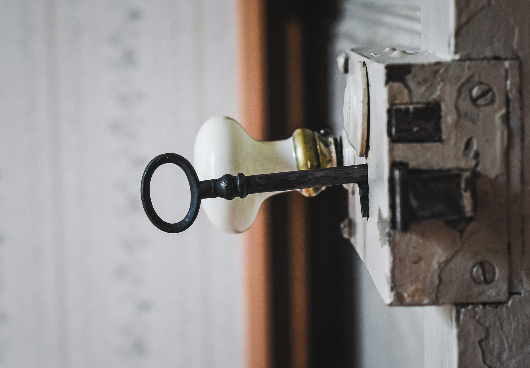 Old metal key in lock
