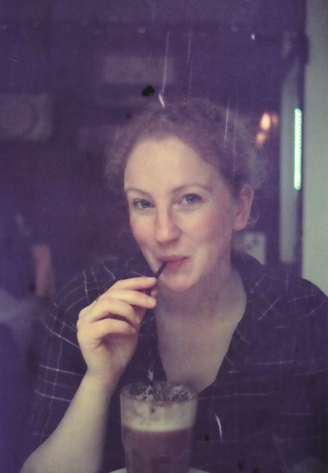 Woman drinking through straw