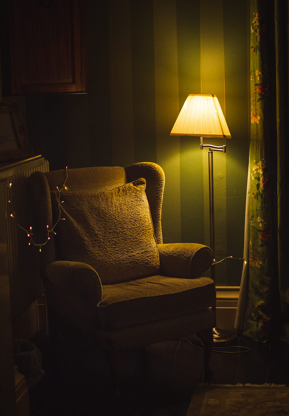 Lamp next to armchair