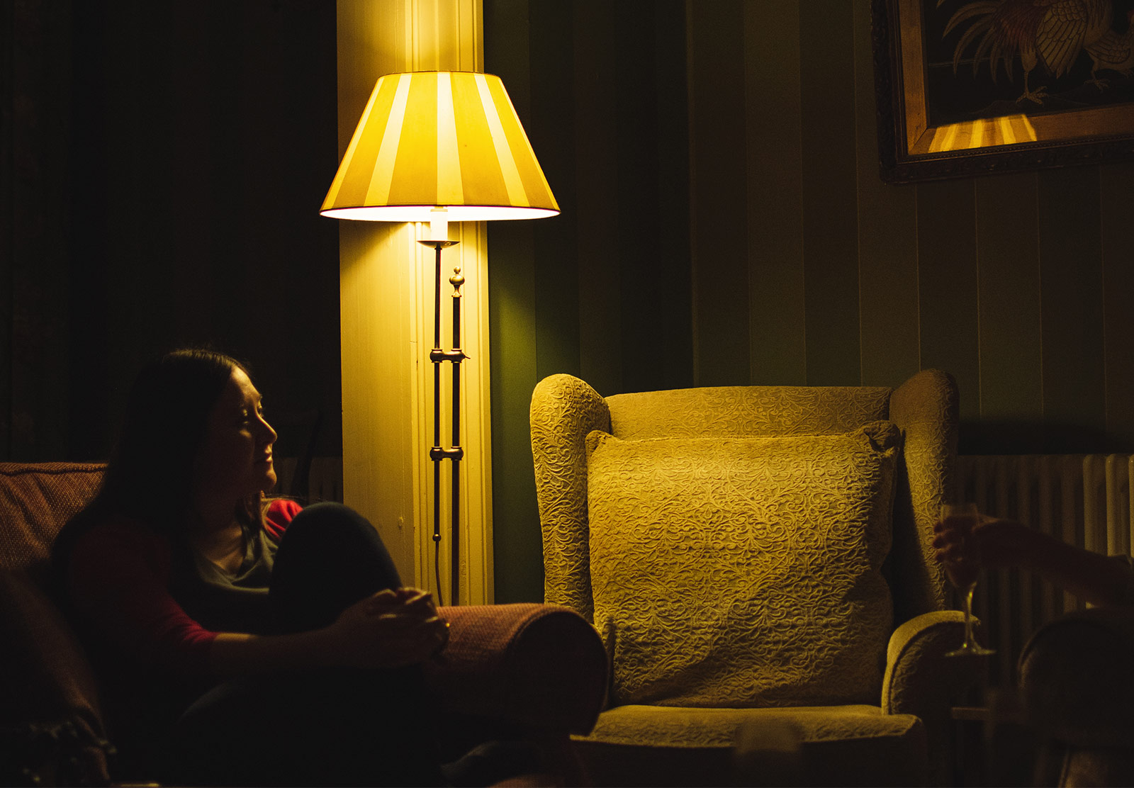 Woman next to lamp