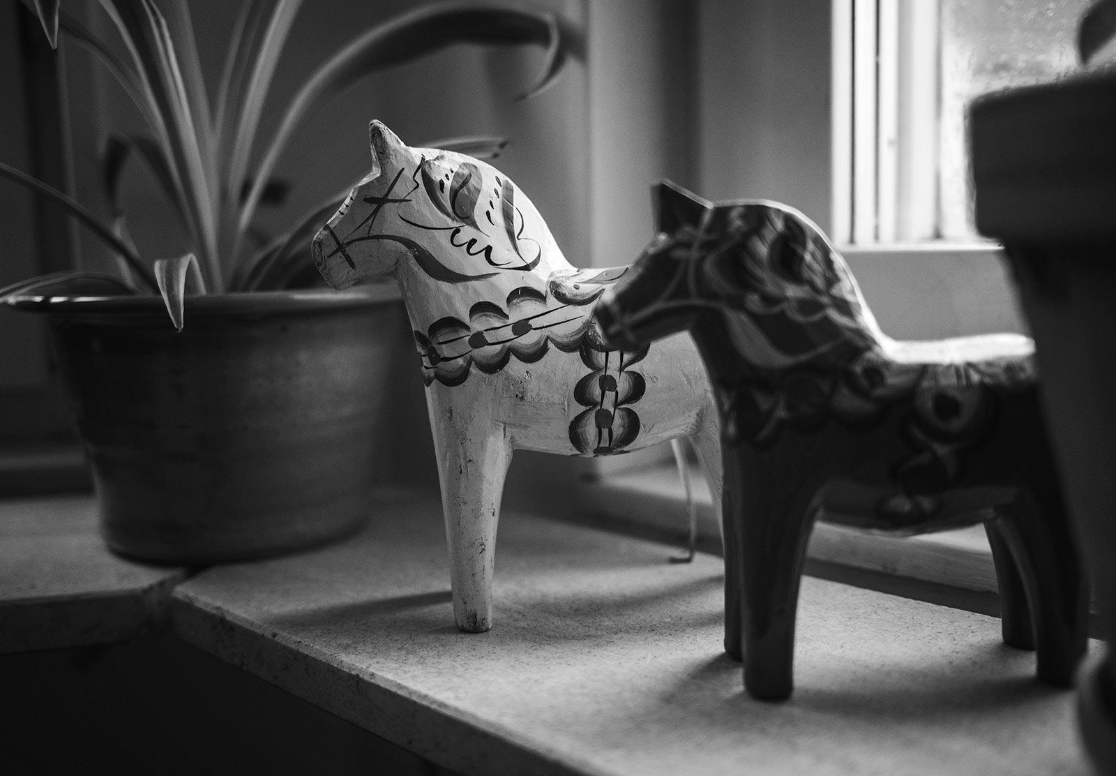 Wooden horse on windowsill