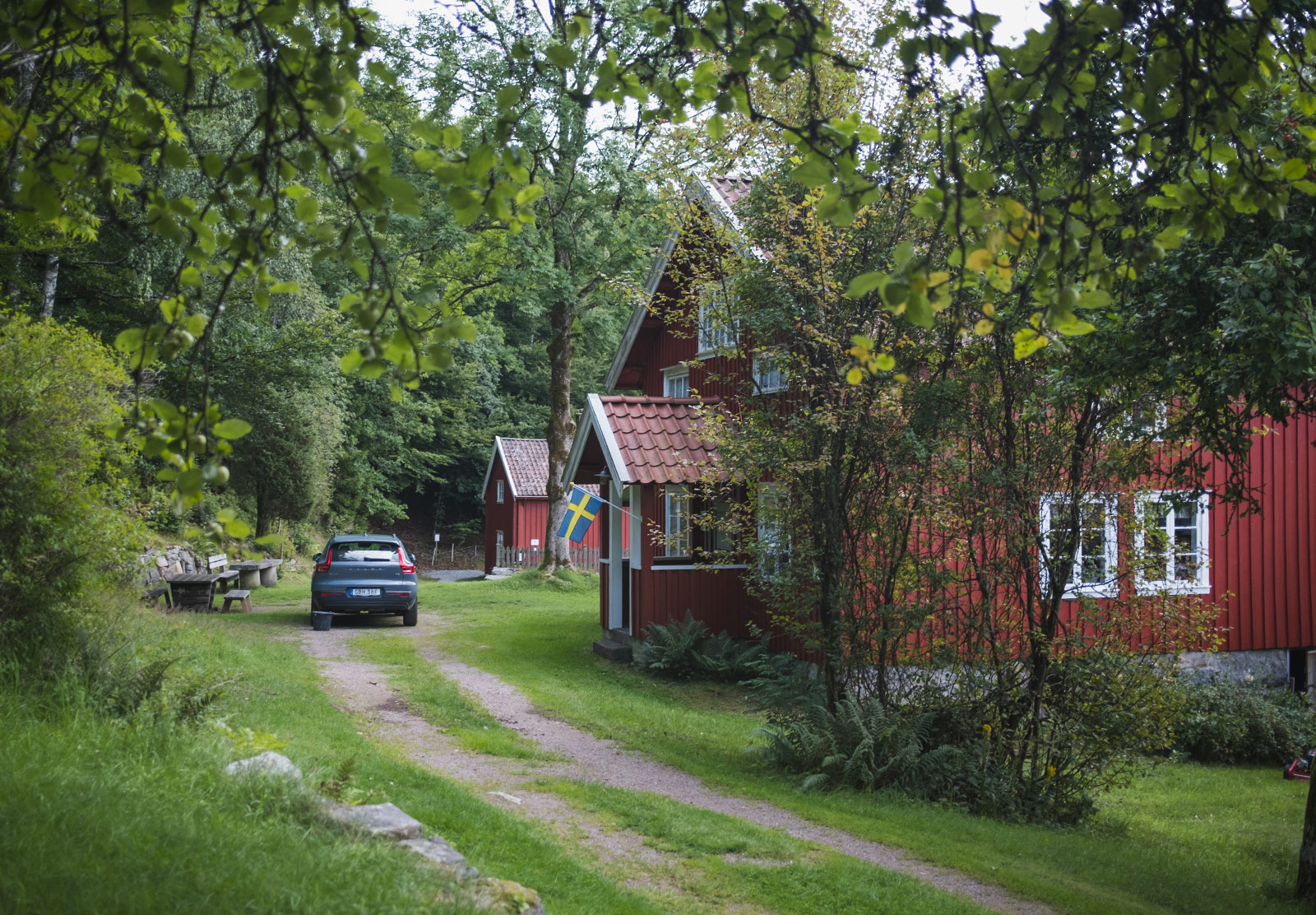 Swedish flag on the front of a wooden house