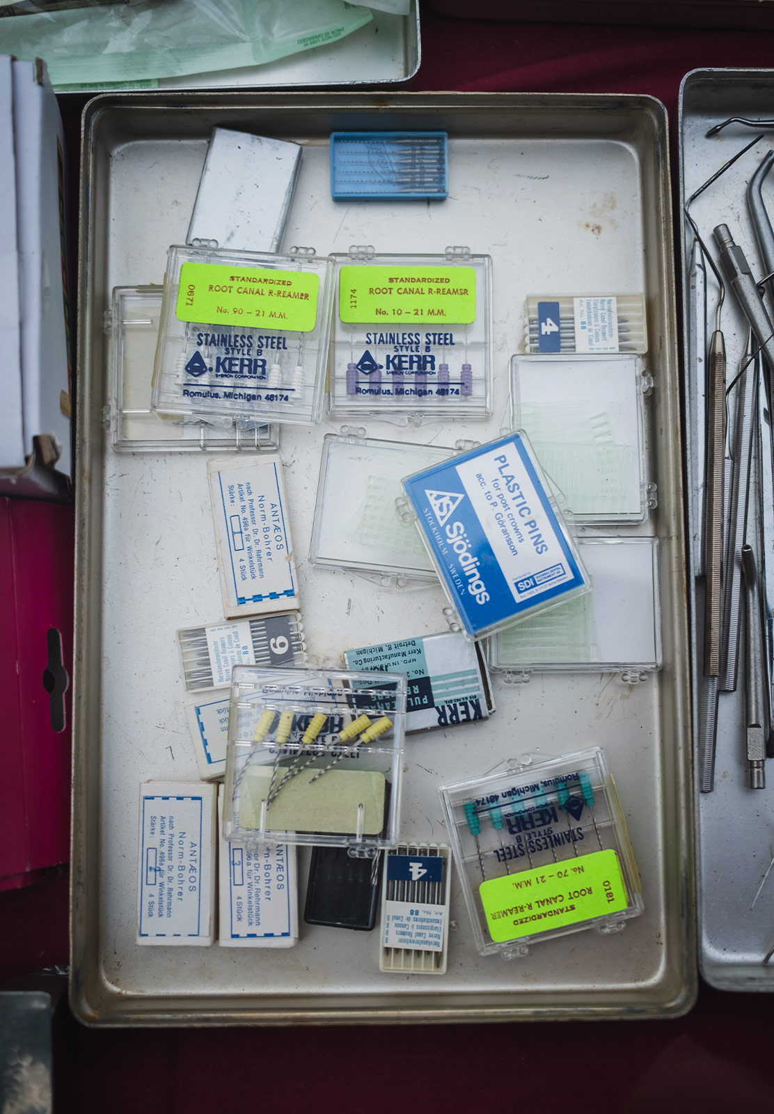Old dental equipment in clear boxes