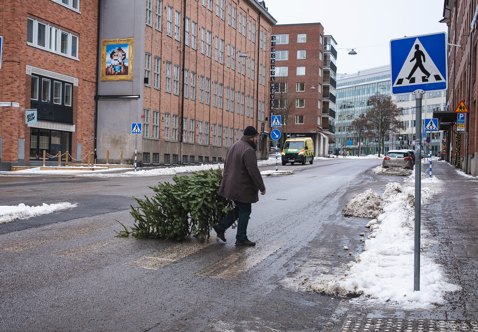 Man dragging xmas tree