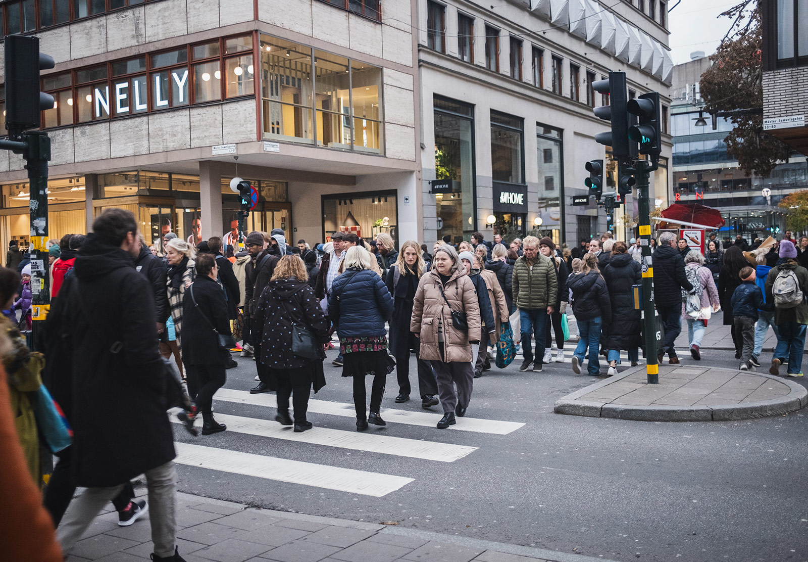 Crowds of people crossing a road