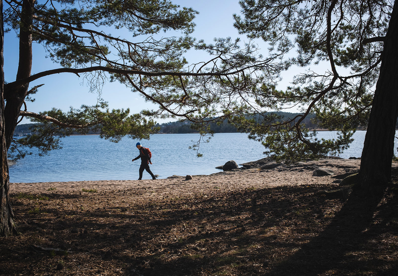 Man walking along beach