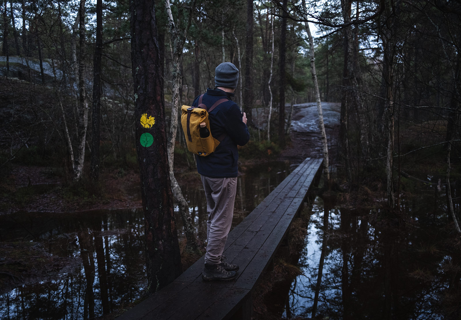 Man walking on wooden boards