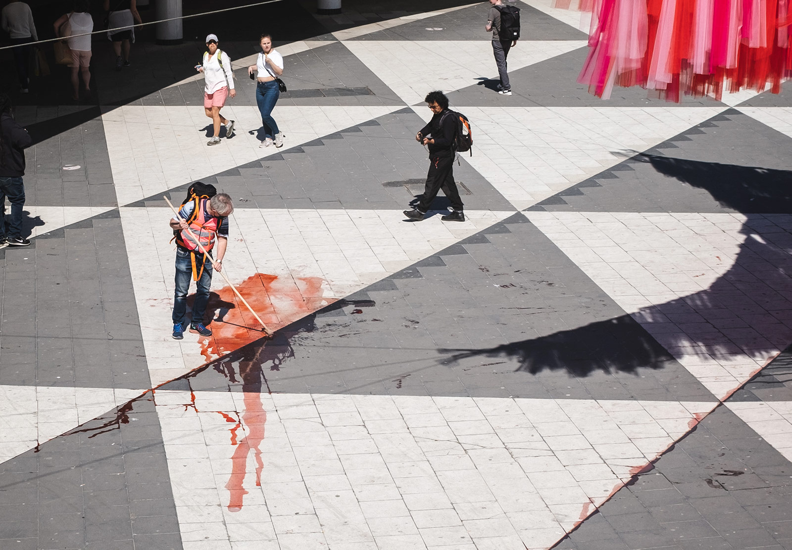 Man cleaning pavement