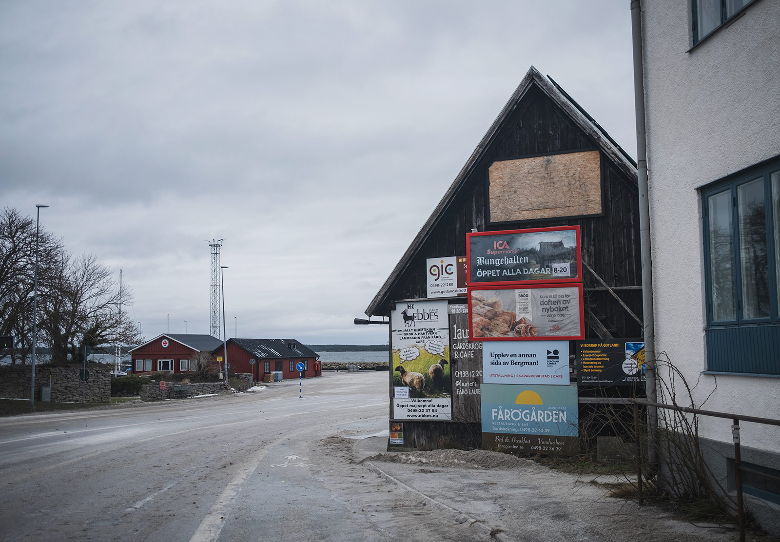 Collection of signs on wooden building