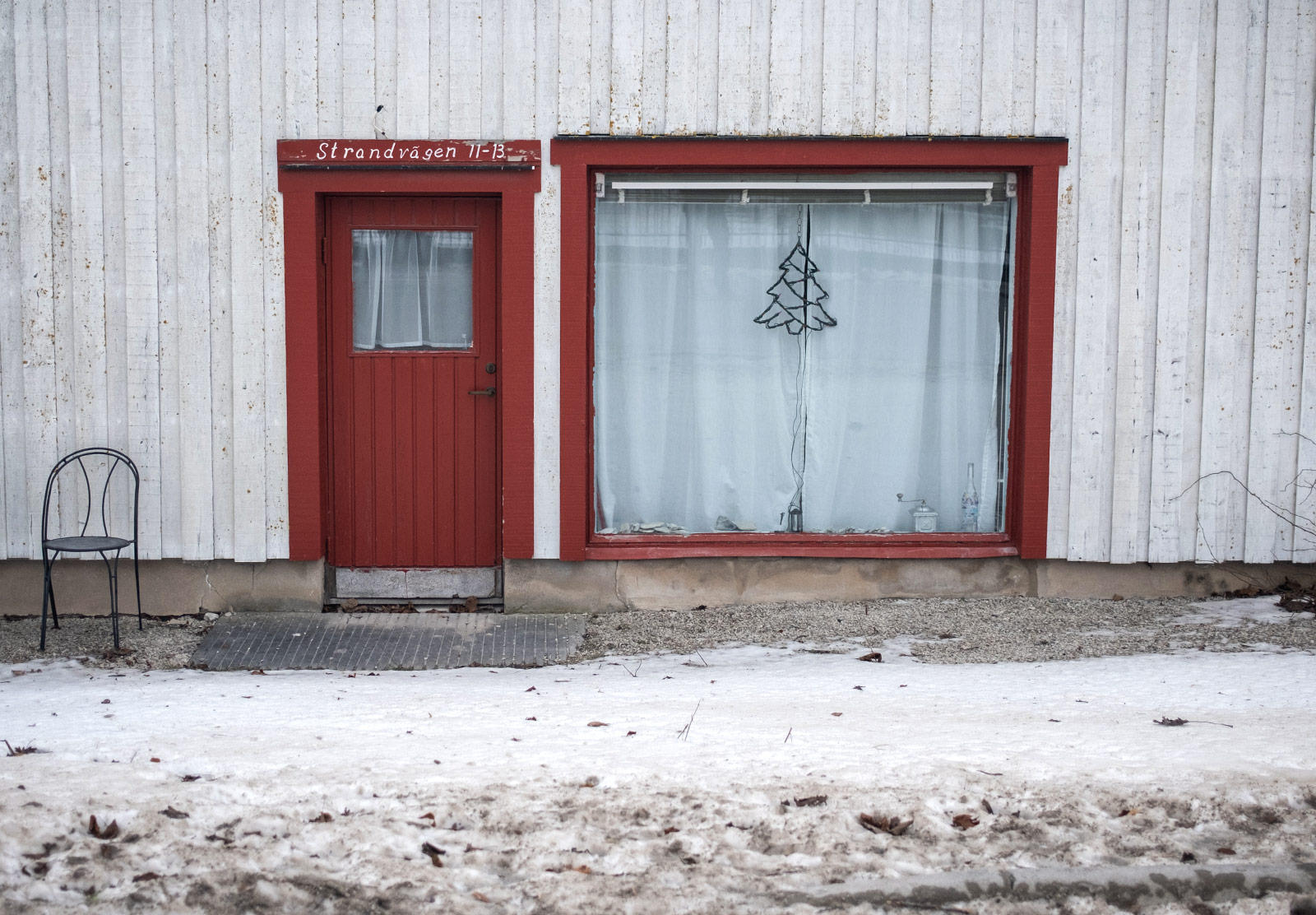 Small wooden door next to window