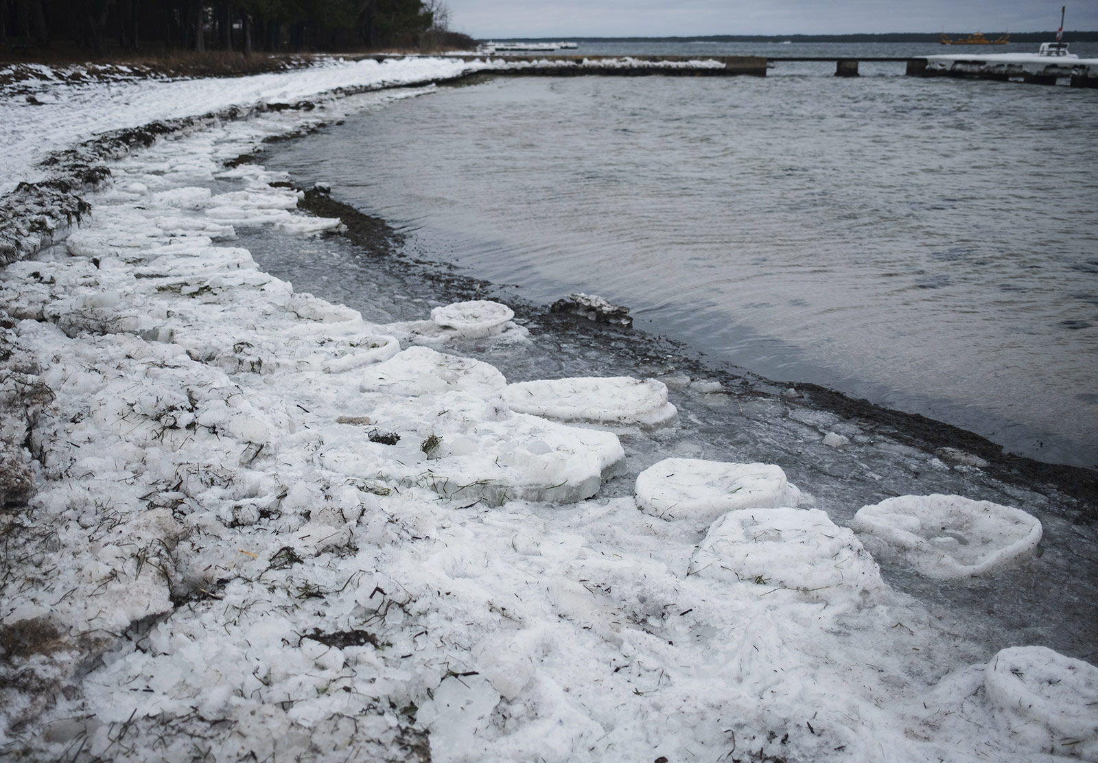 Arched shore covered in chunks of ice
