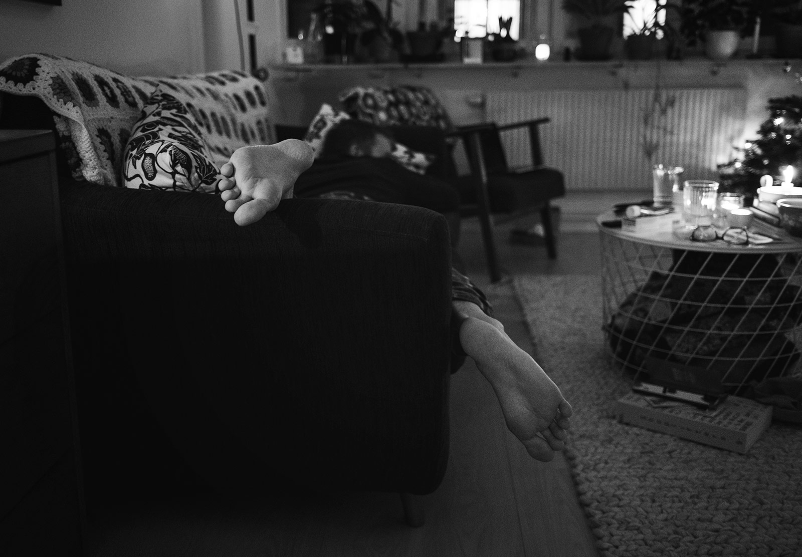 Feet hanging off sofa