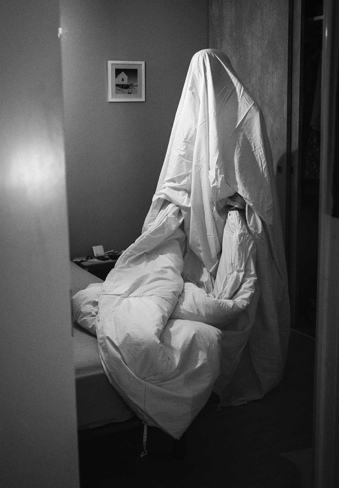 Man under sheet