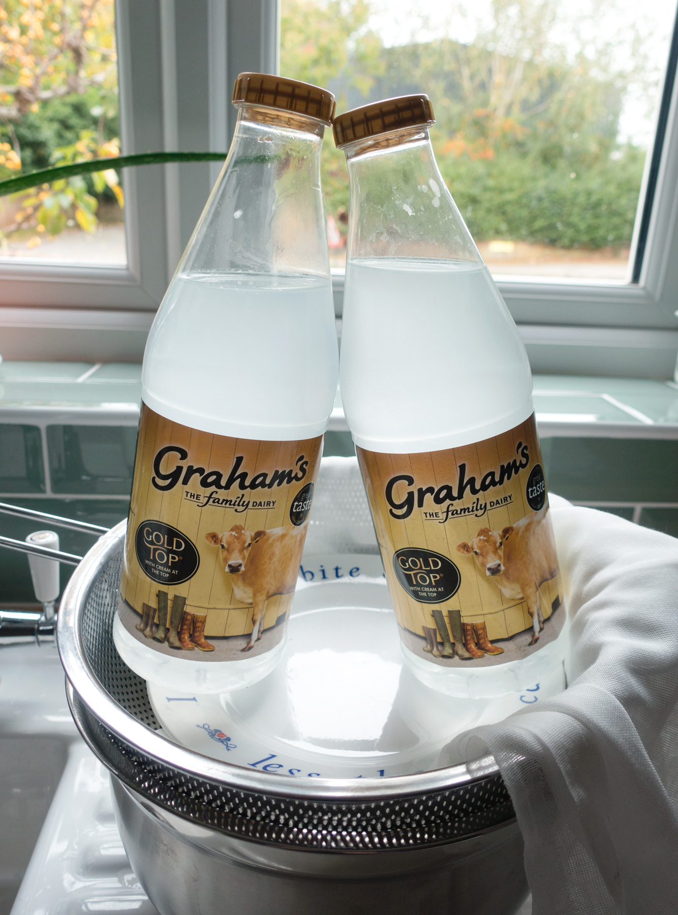 Bottles pressing down cheese