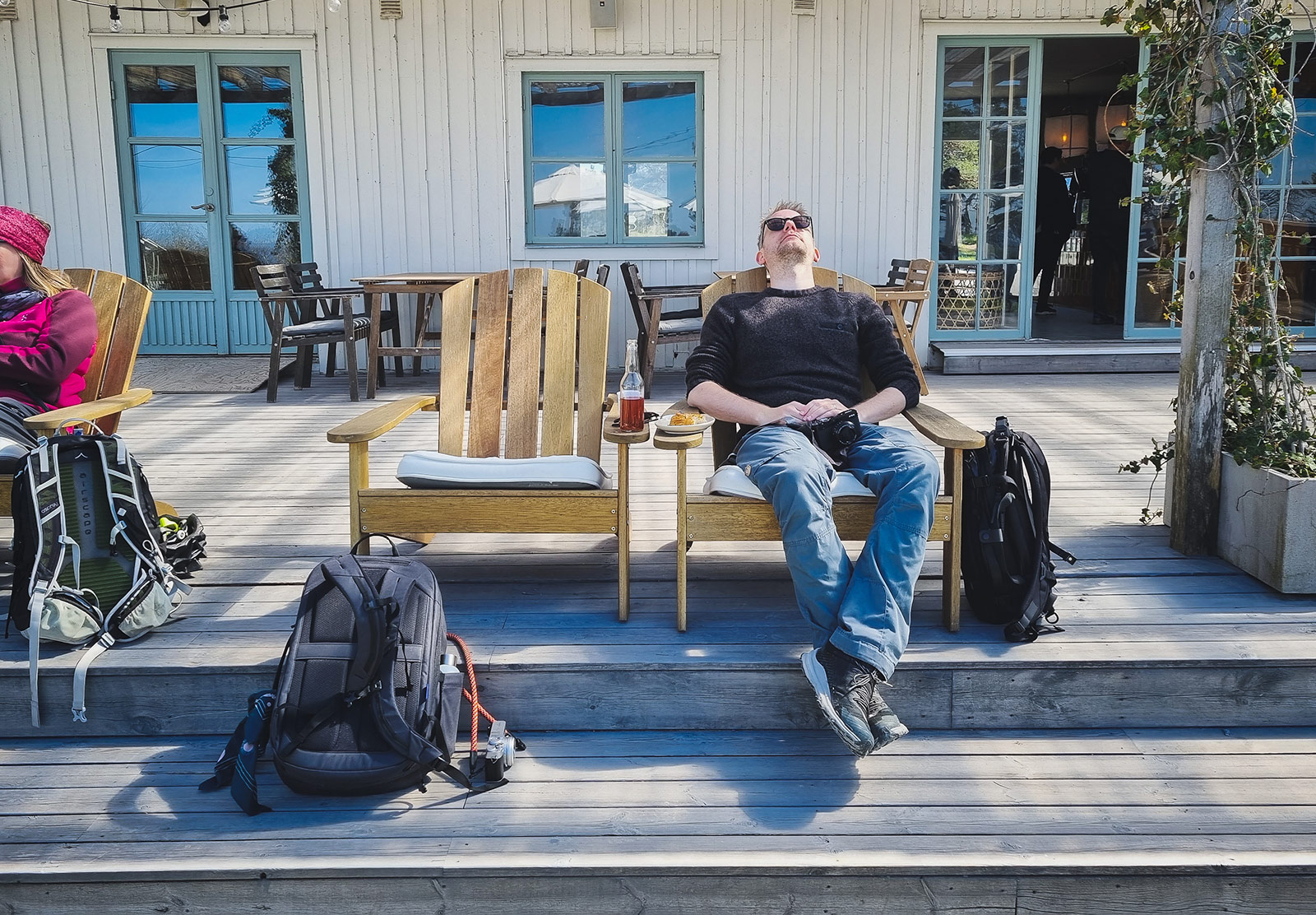 Man relaxing doors in chair