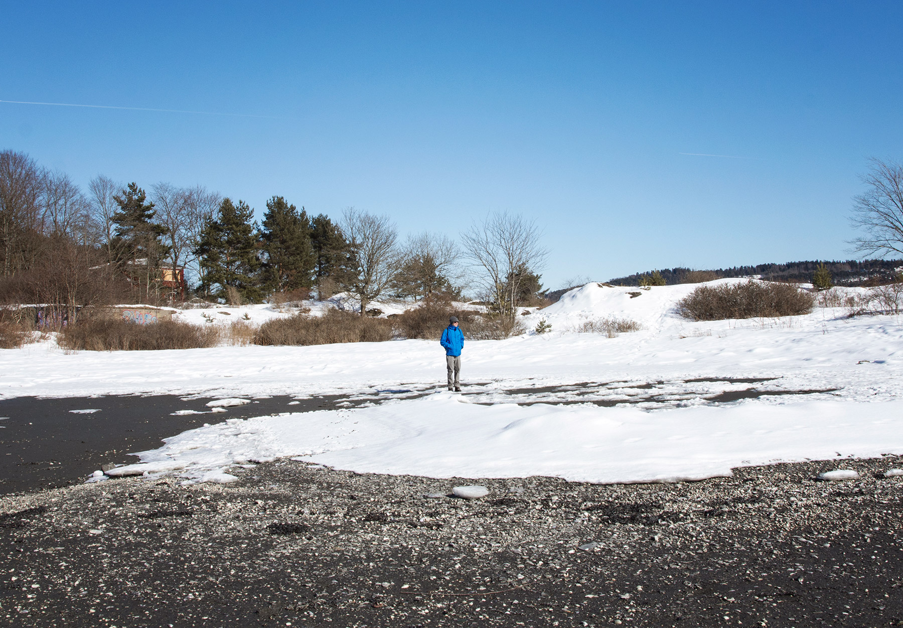 Man on frozen beach