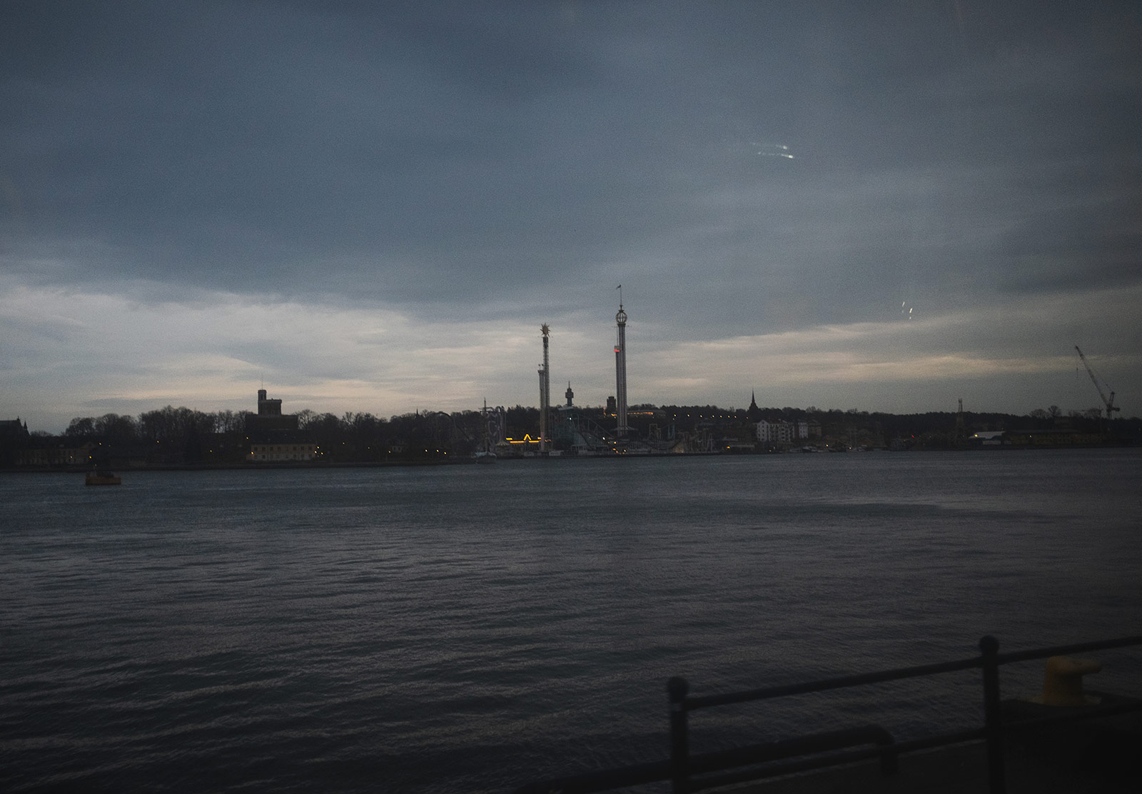 Distant theme park lights in gloomy light