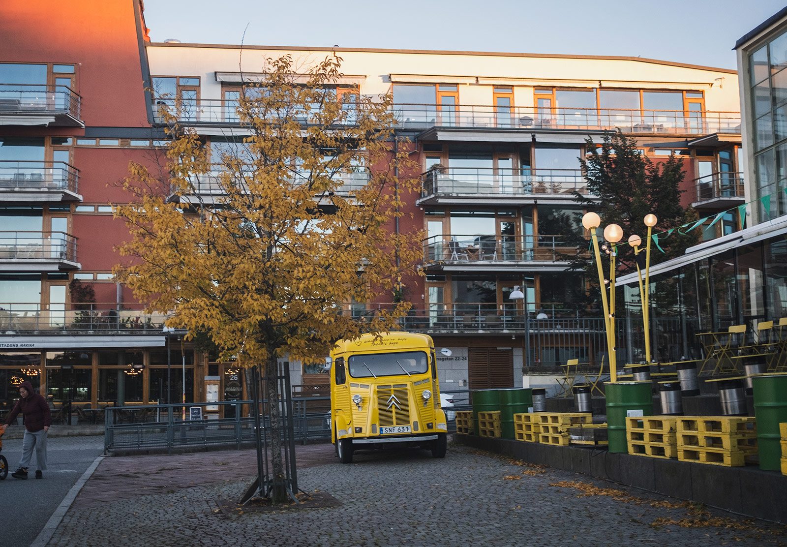 Bright van parked under tree