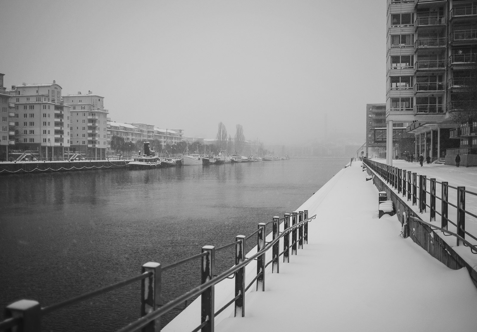 Snow hanging in the air over water