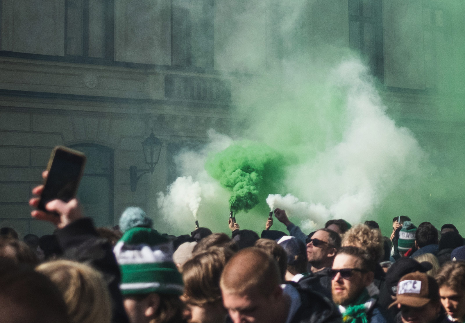 Crowd of people in green gas