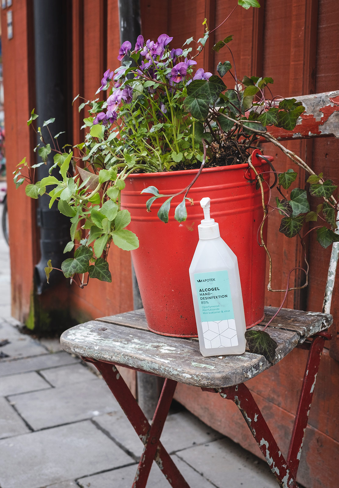 Bottle of sanitiser on chair