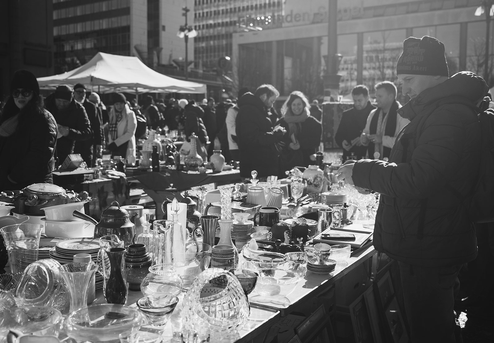 Man looking at glassware