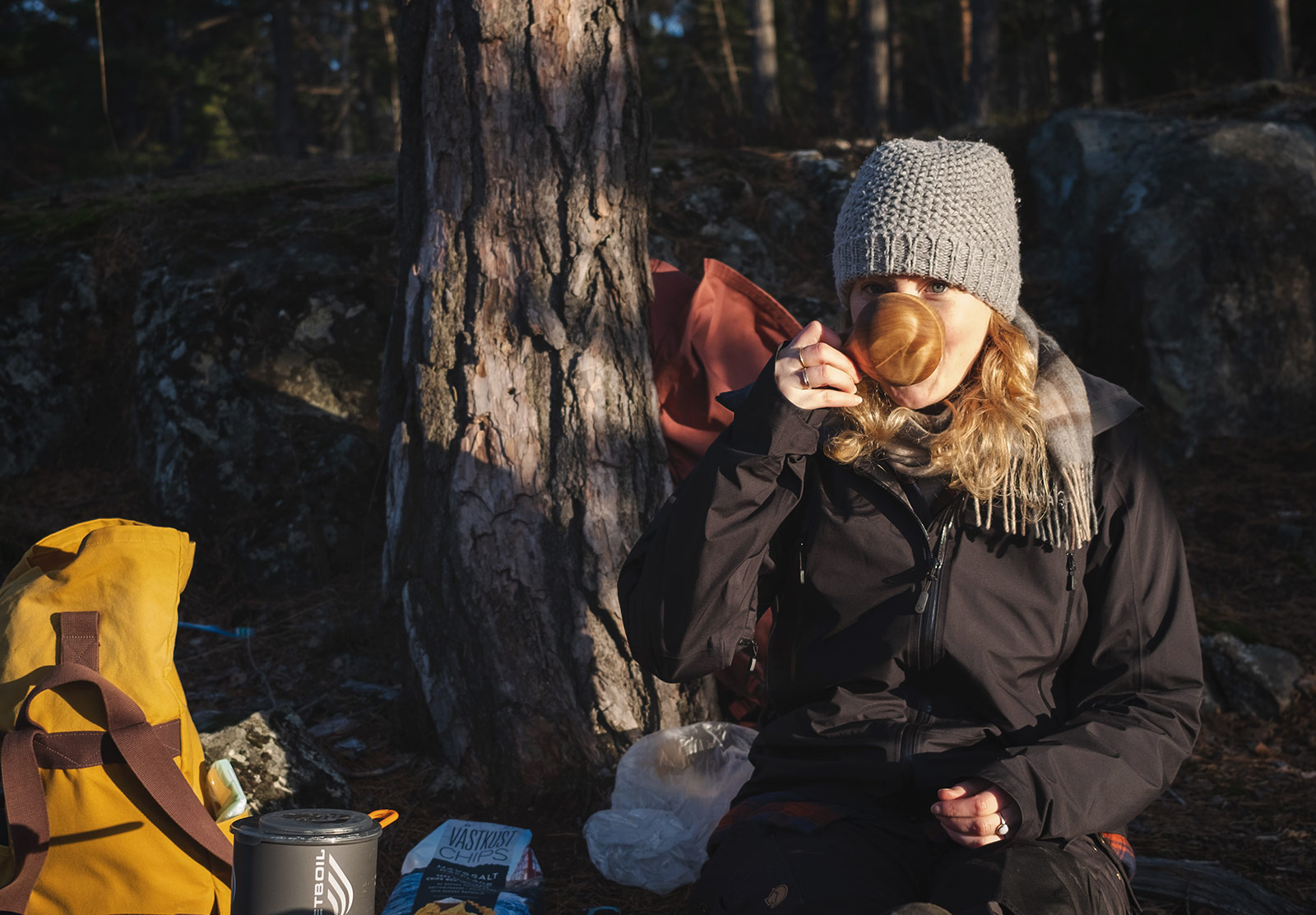 Drinking from a wooden cup