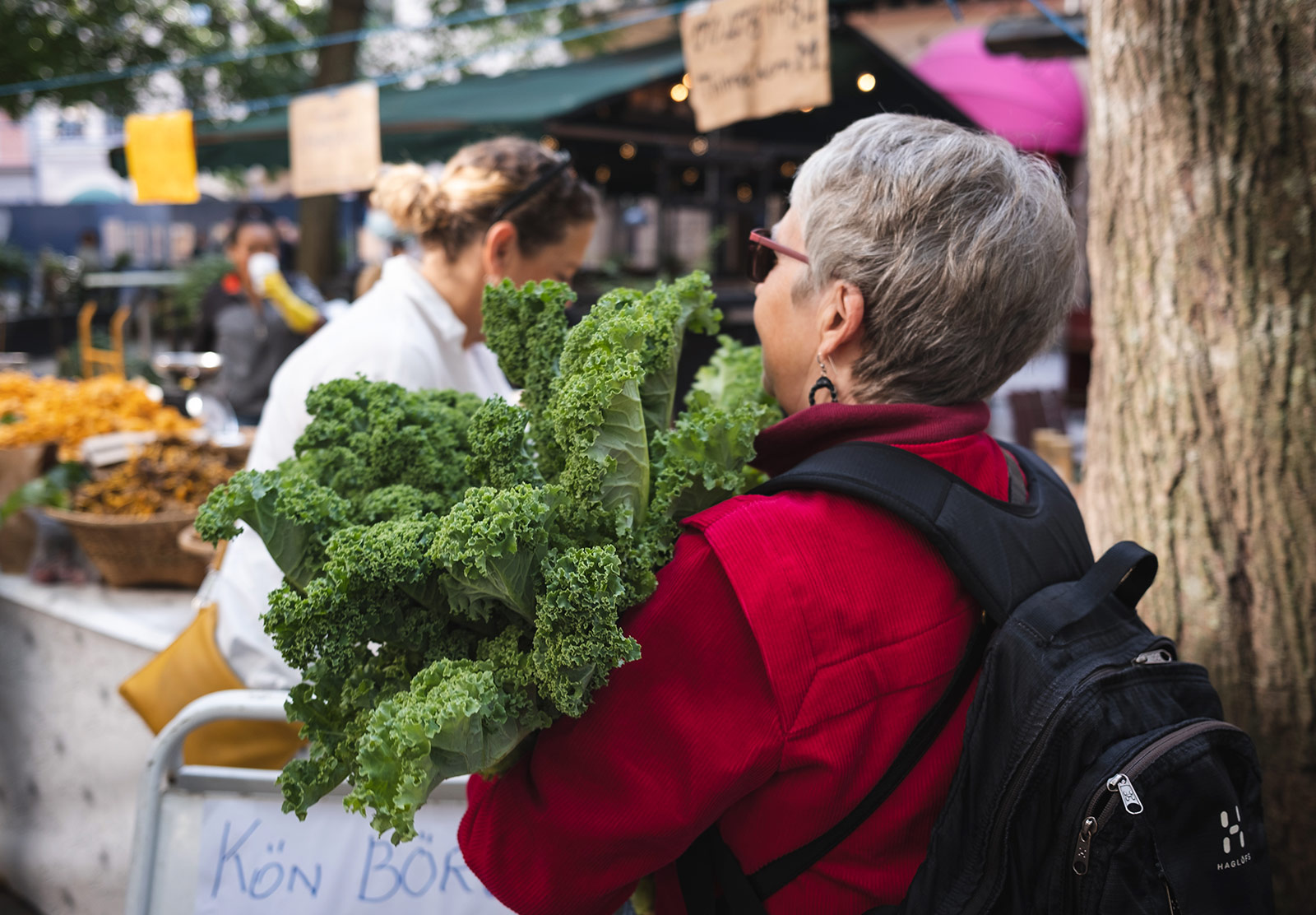 Woman holding a bunch of kale