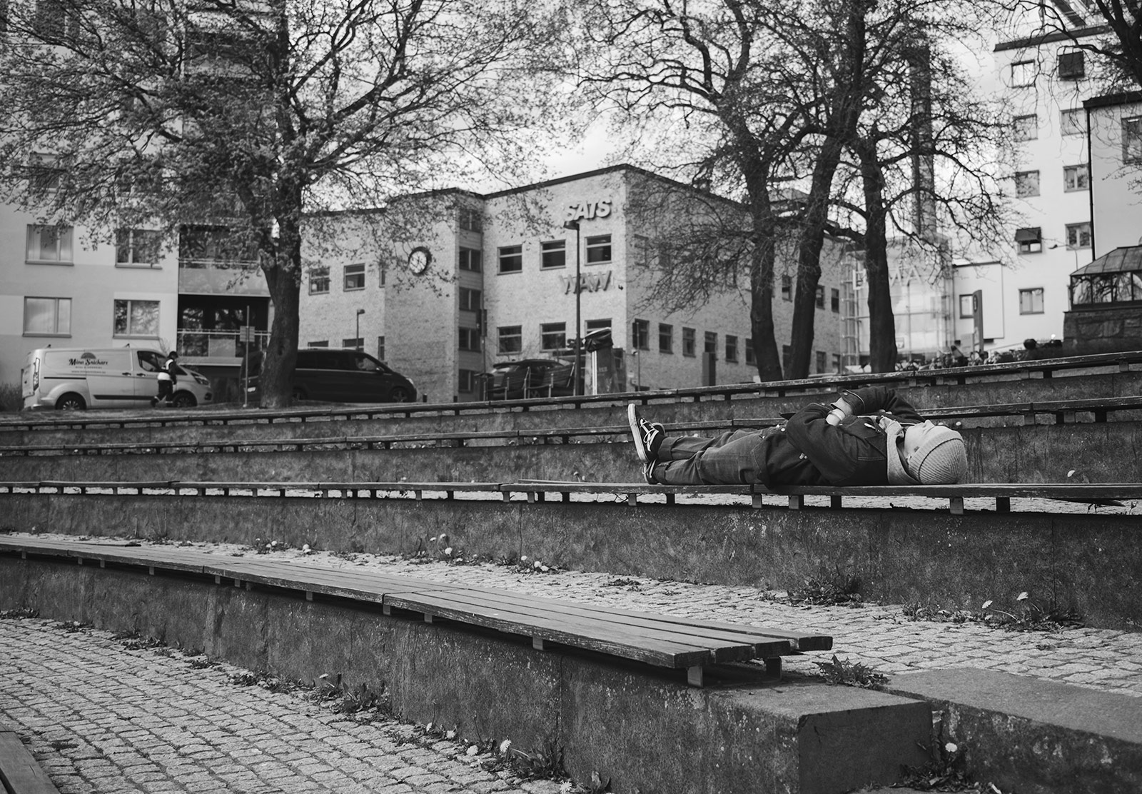 Man laying on bench