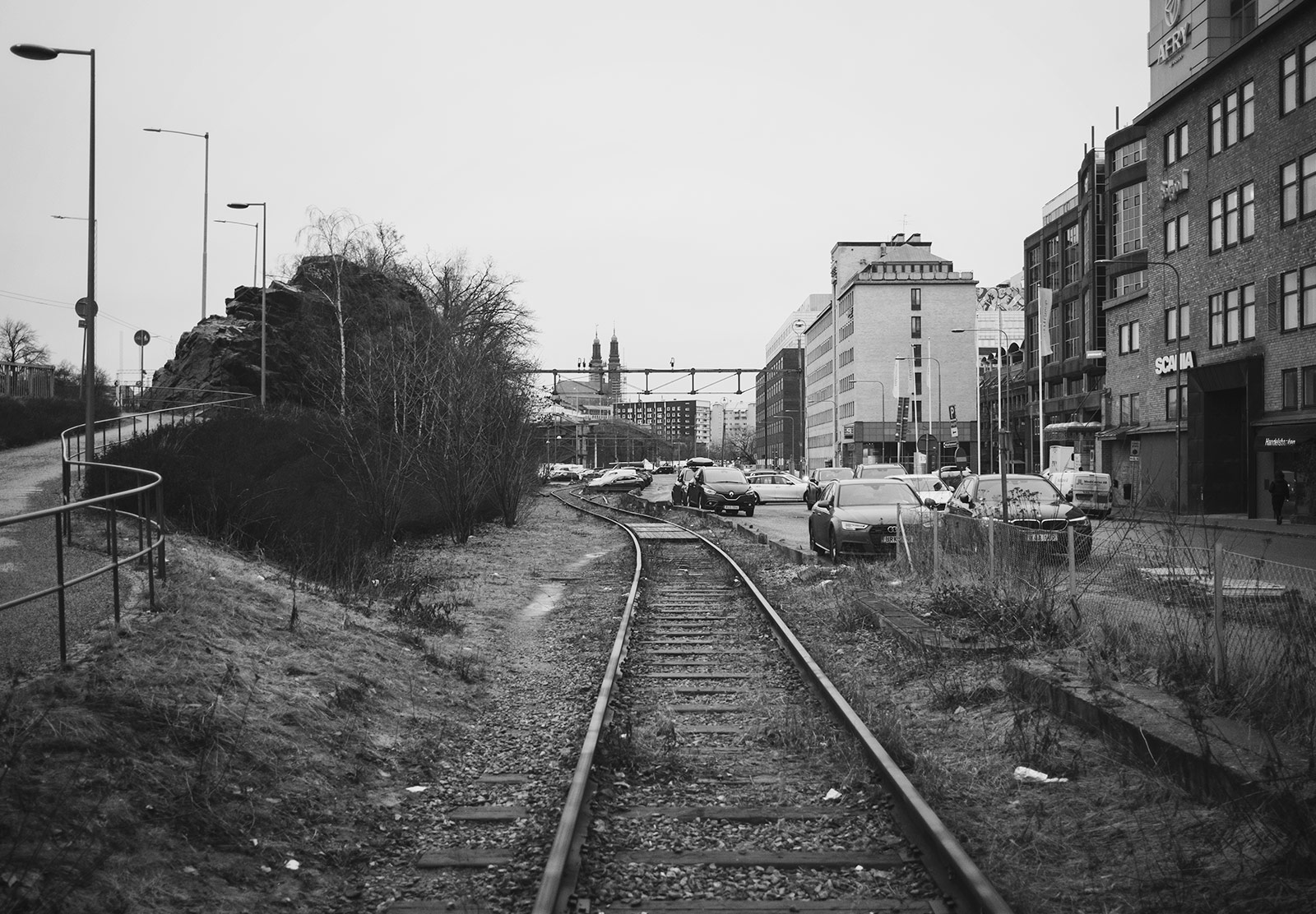 Grass covered railway tracks