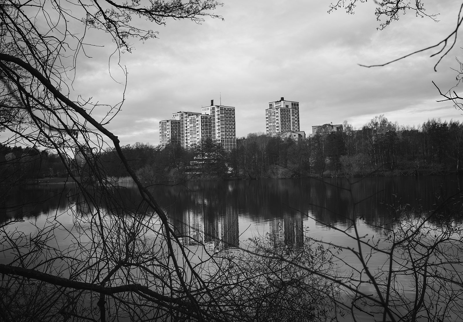Tower blocks reflected in water