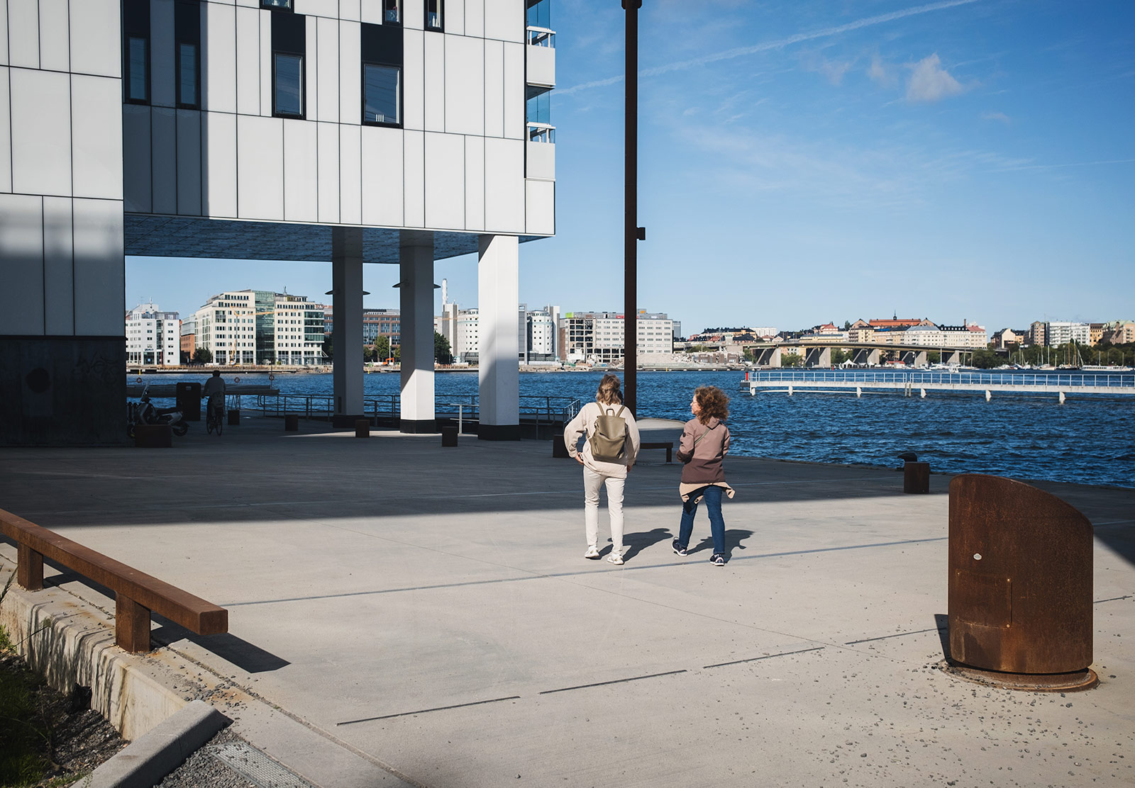 Women walking by the water