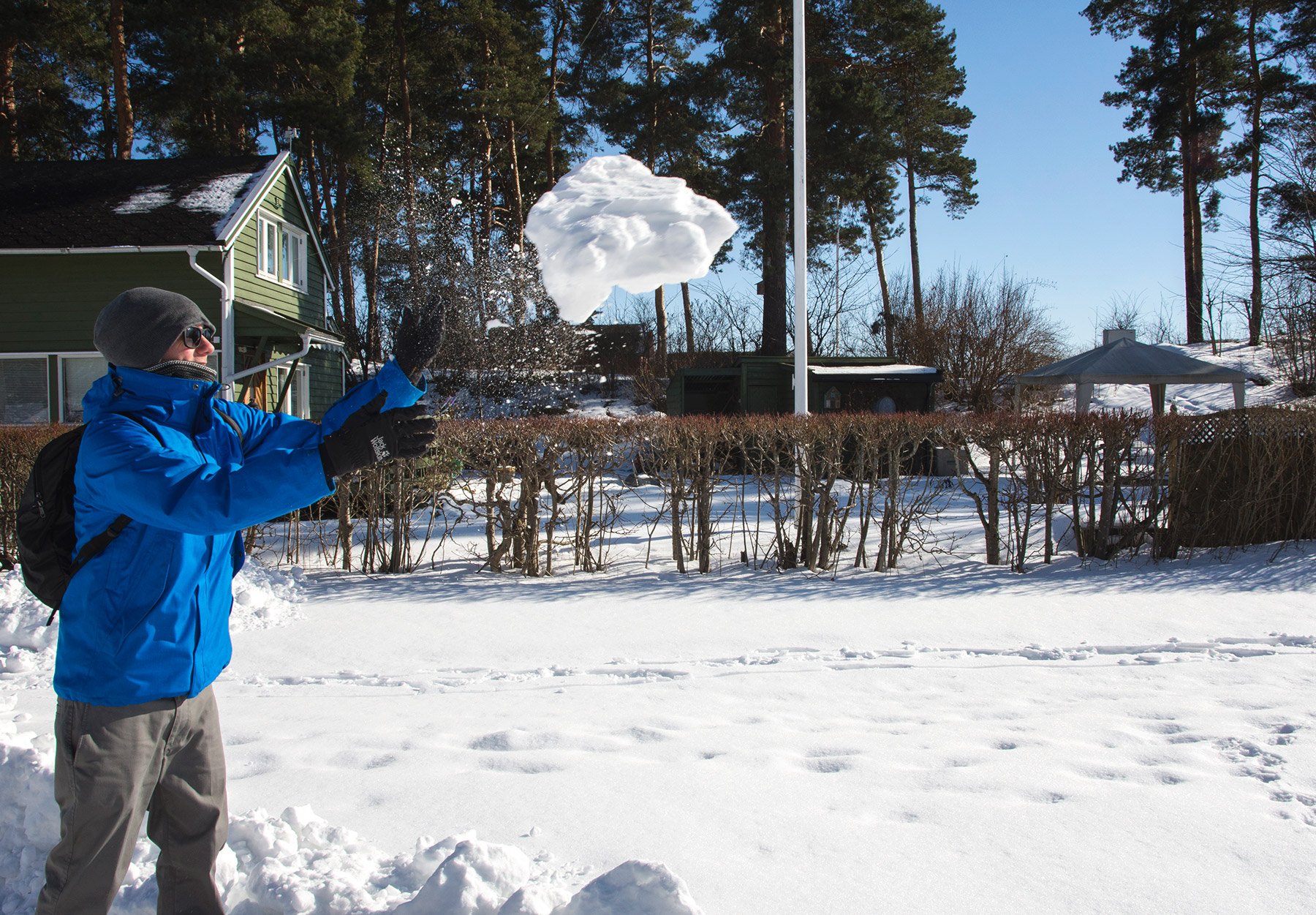 Man throwing giant snowball