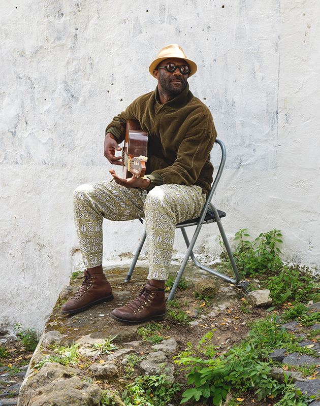 Sitting guitarist
