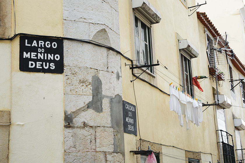 Street signs on pastel wall