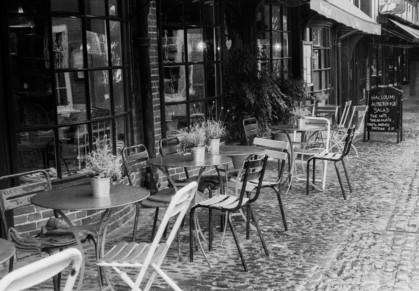 Tables and chairs on street