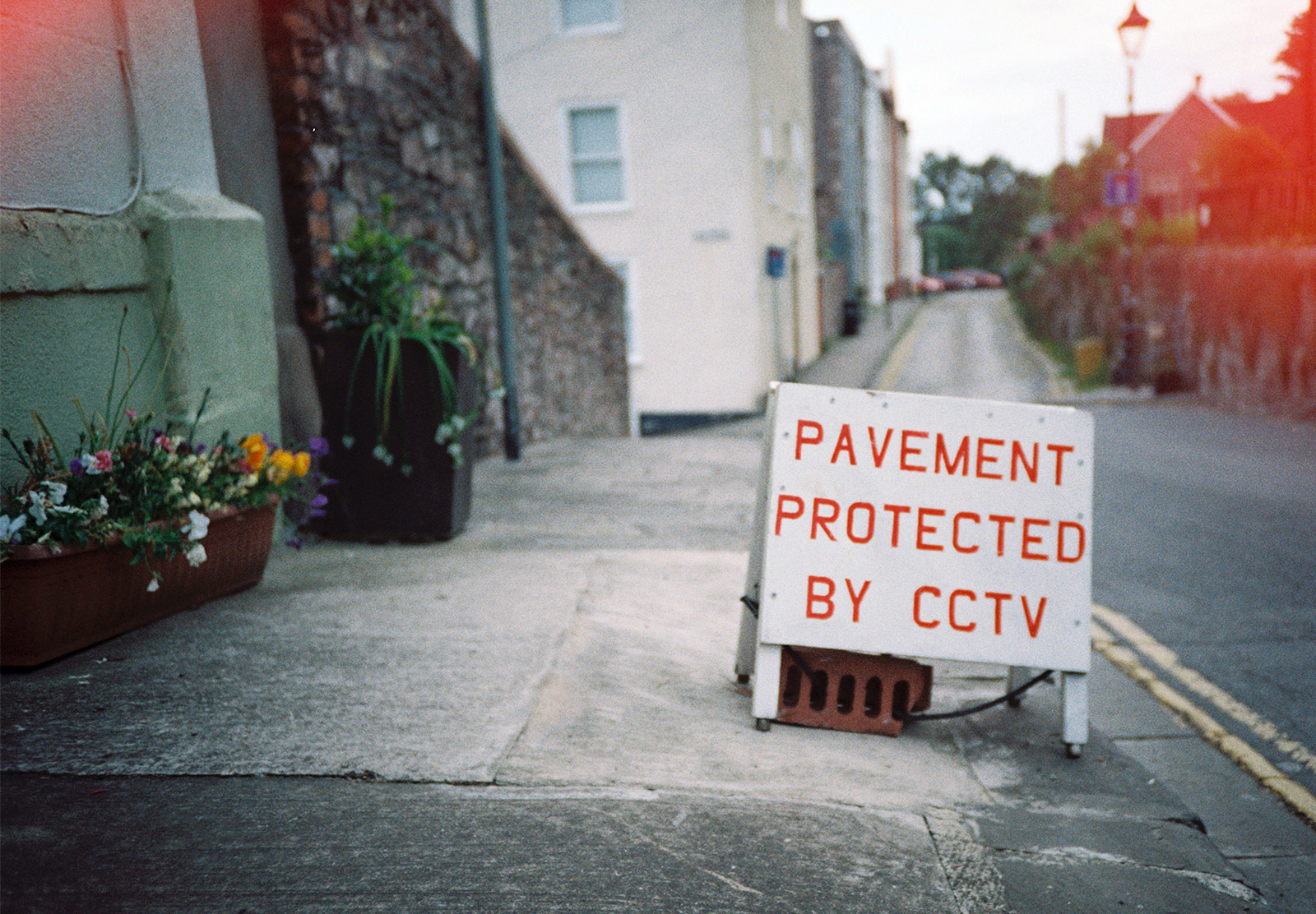Pavement protected by CCTV sign
