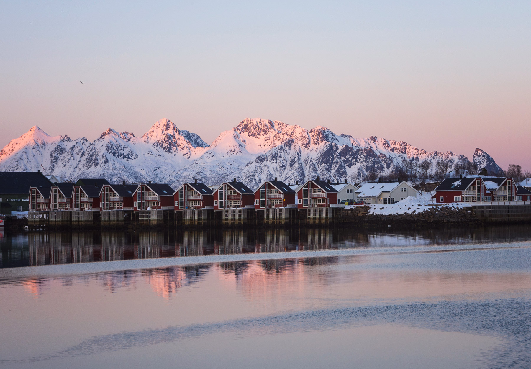 Pink glow on snow covered mountains