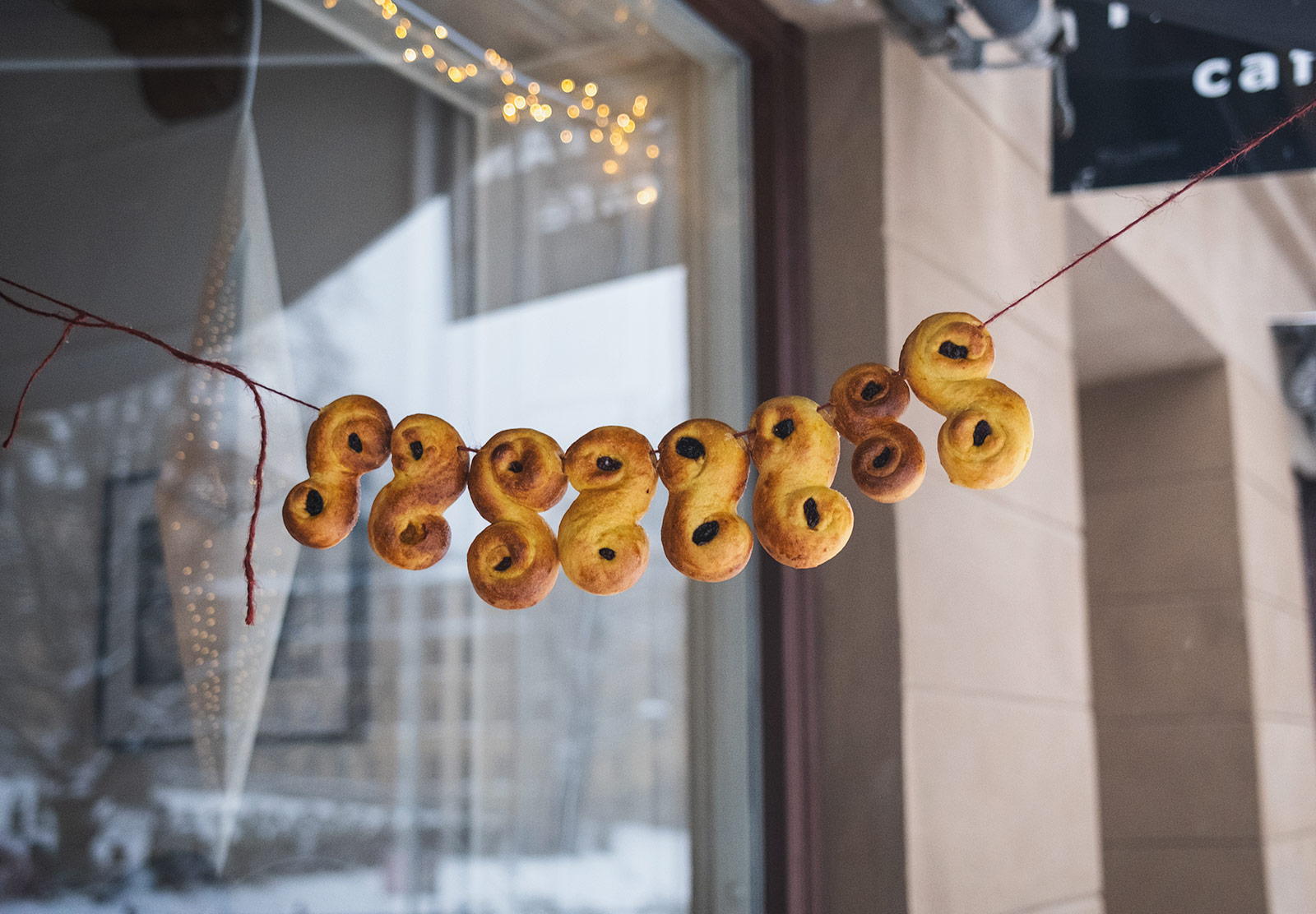 Golden buns hanging on string outside
