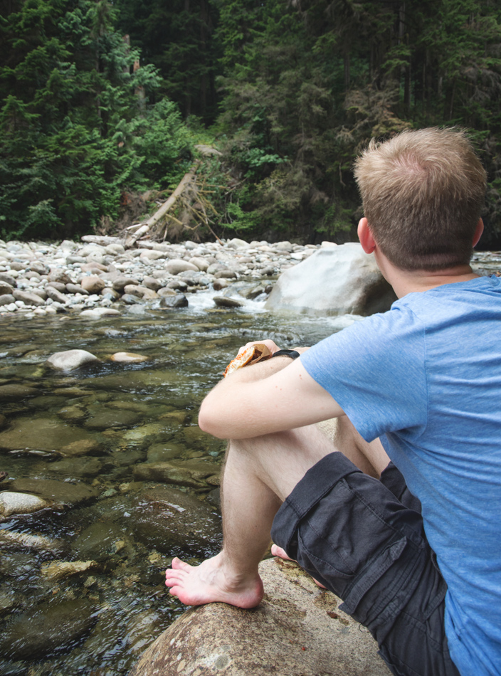 Man looking over creek