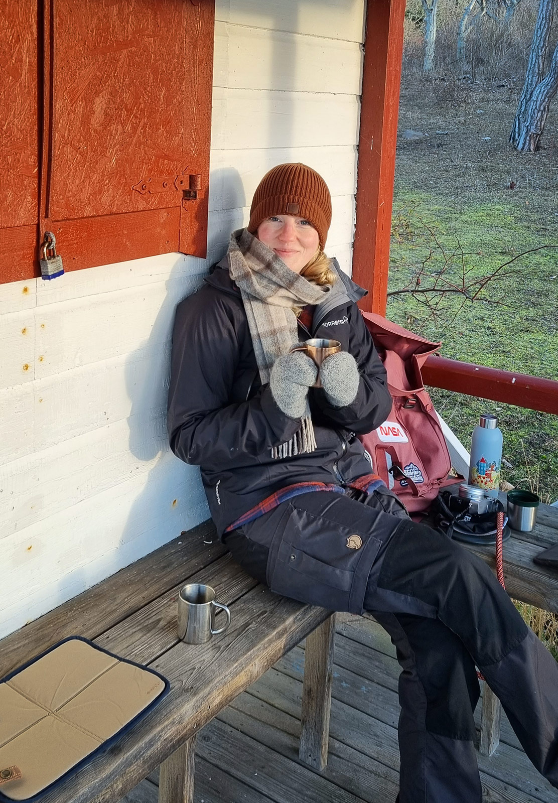 Woman sat on wooden bench