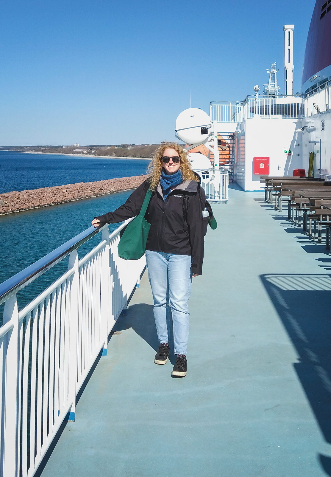 Woman stood on sundeck of ship
