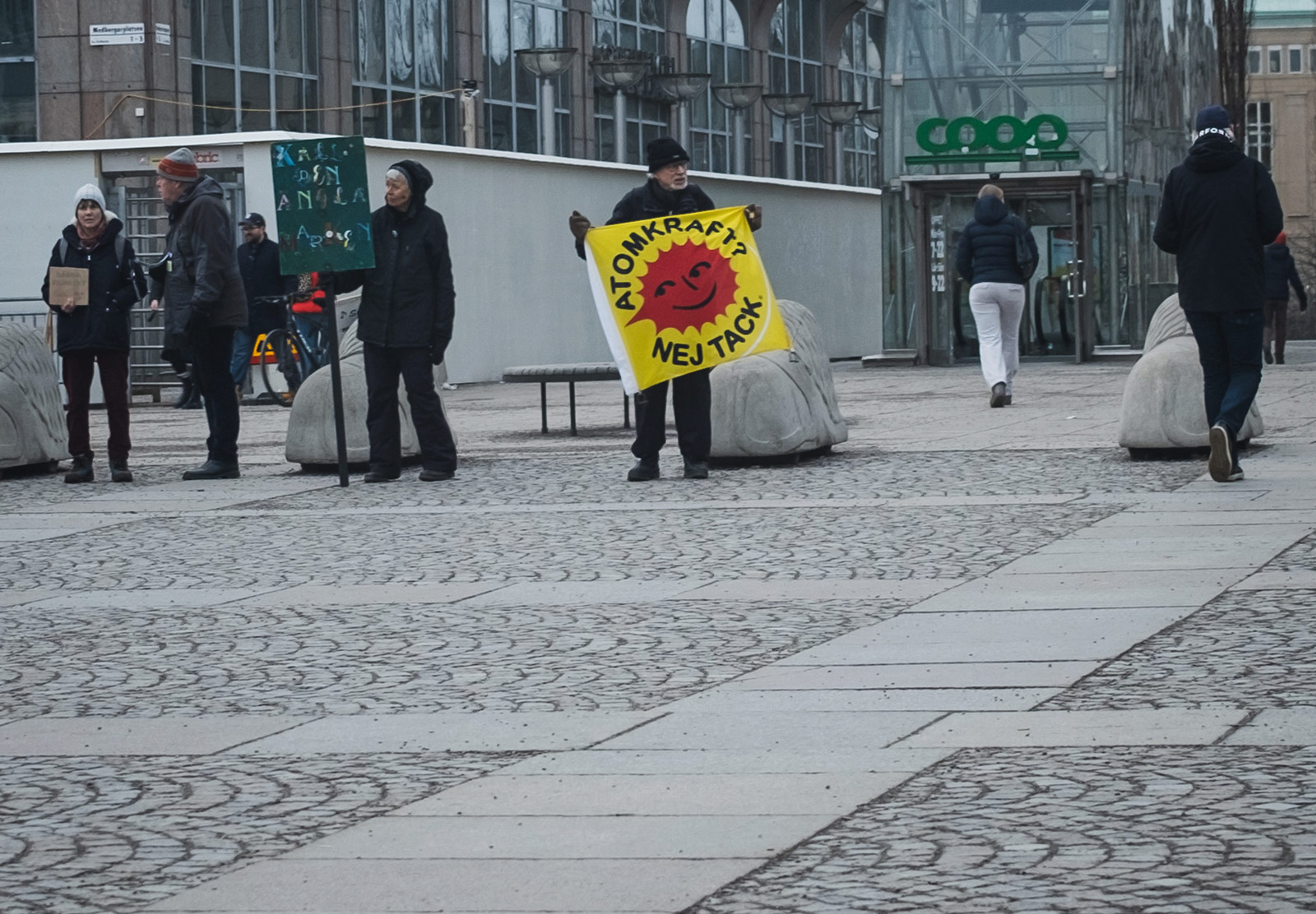 Man holding nuclear power protest sign