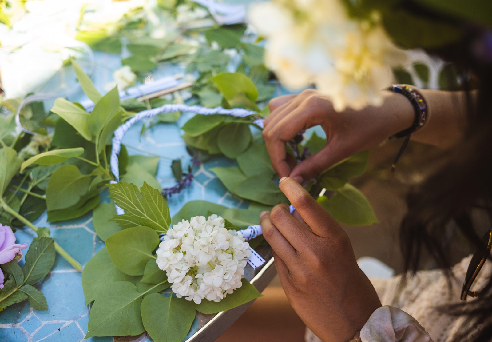 Tying flowers with ribbon