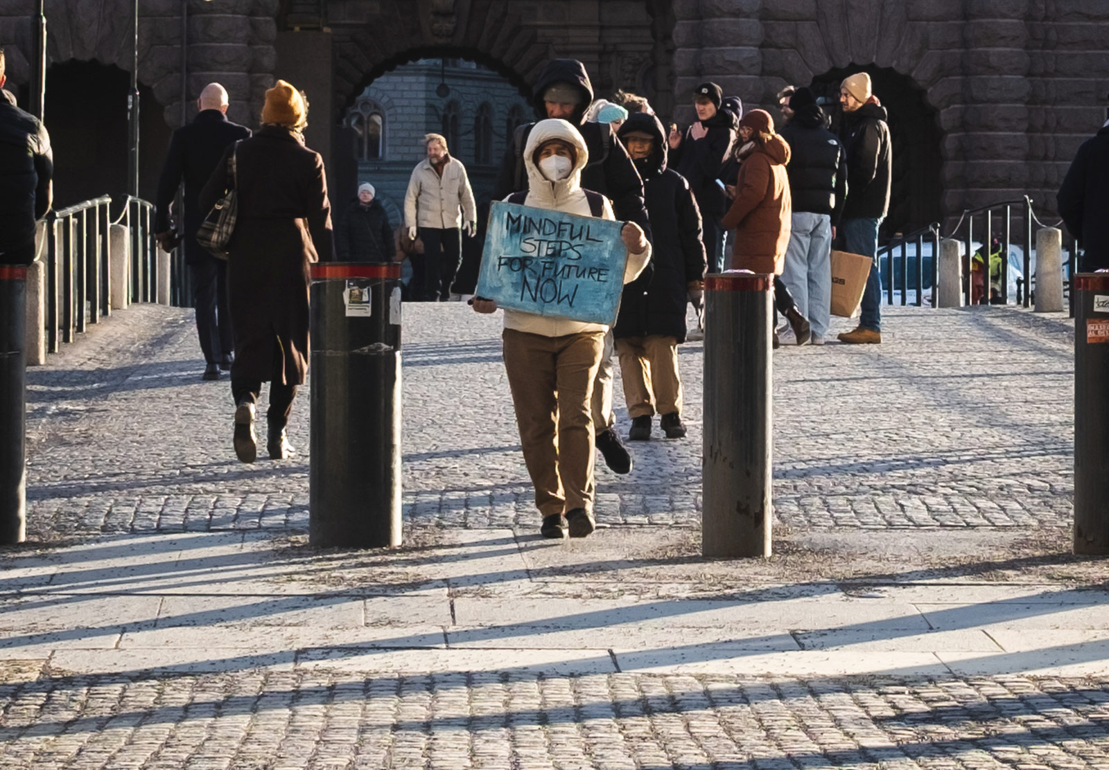 Woman holding handwritten sign