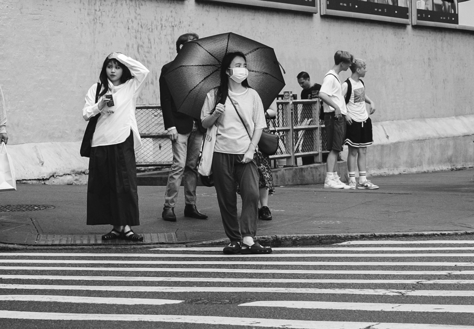 Woman standing with umbrella