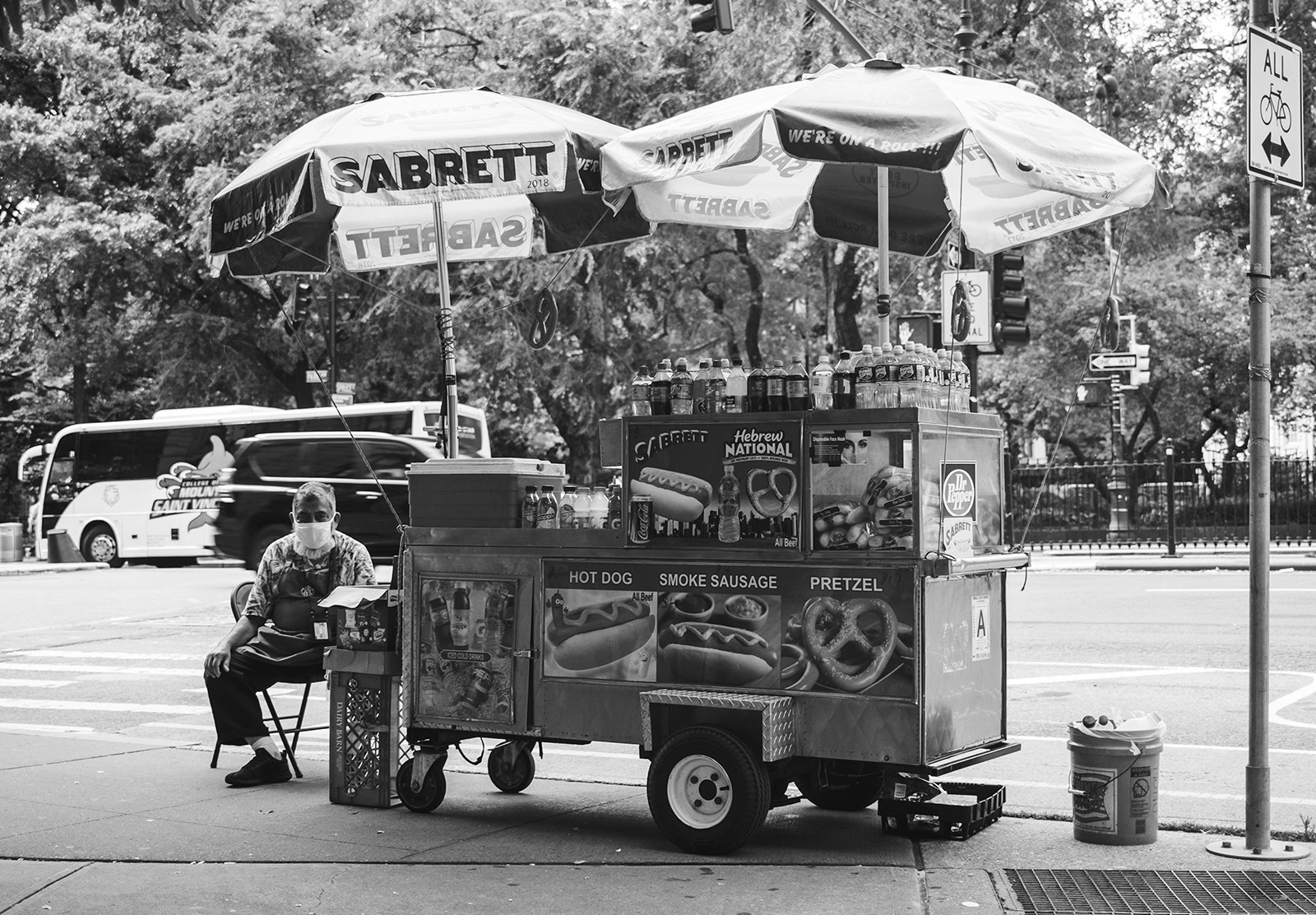 Man sat at hotdog cart