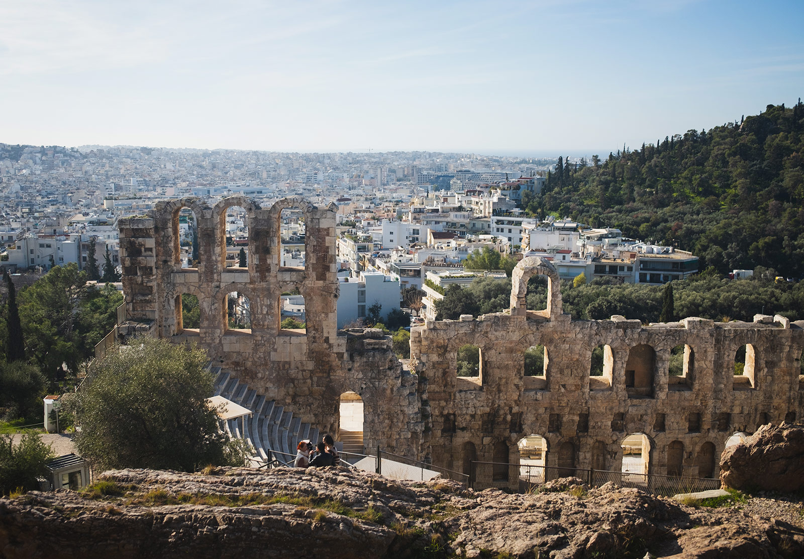Old archways with city backdrop
