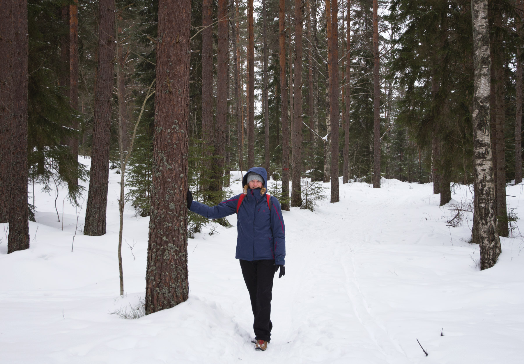 Me leaning against a tree