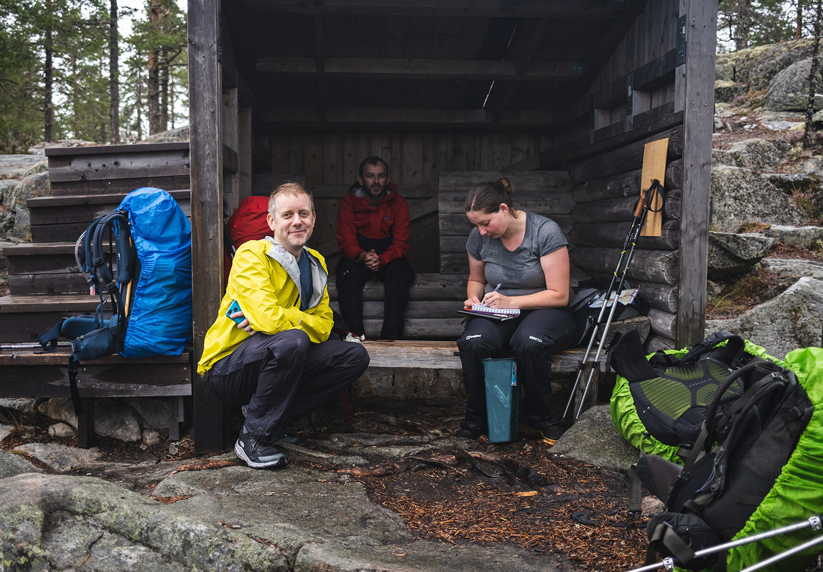 People sat in wooden shelter